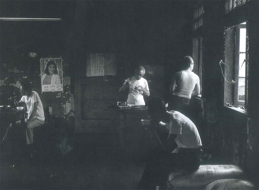 Photo by Paul Calhoun of Chinese laundry workers in Chinatown on lunch break in the 1980s