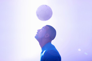 soccer player hitting ball with head