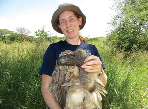 Conservation biologist Corinne Kendall holding a vulture