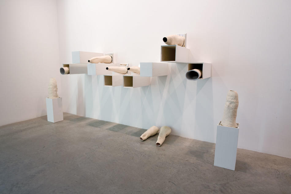 "Digits I-X" (ceramic) and "Supports I-X" (plywood, house paint, and plaster), by N. Dash