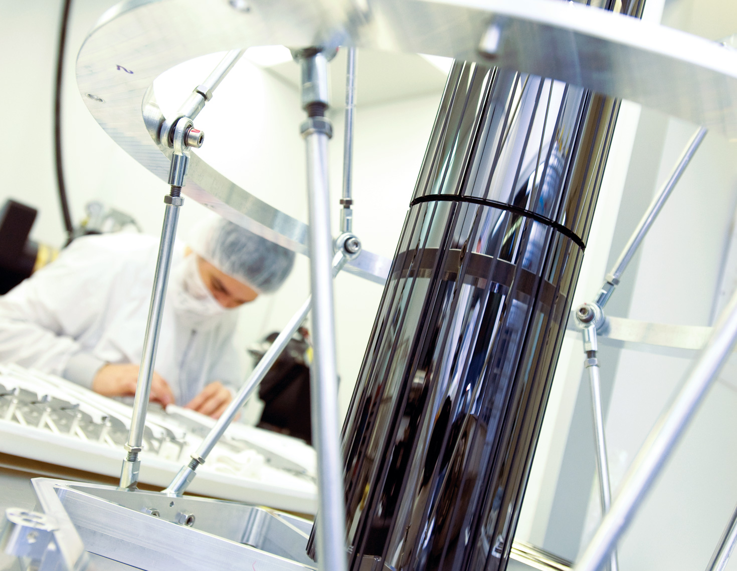 Scientist in lab behind telescope