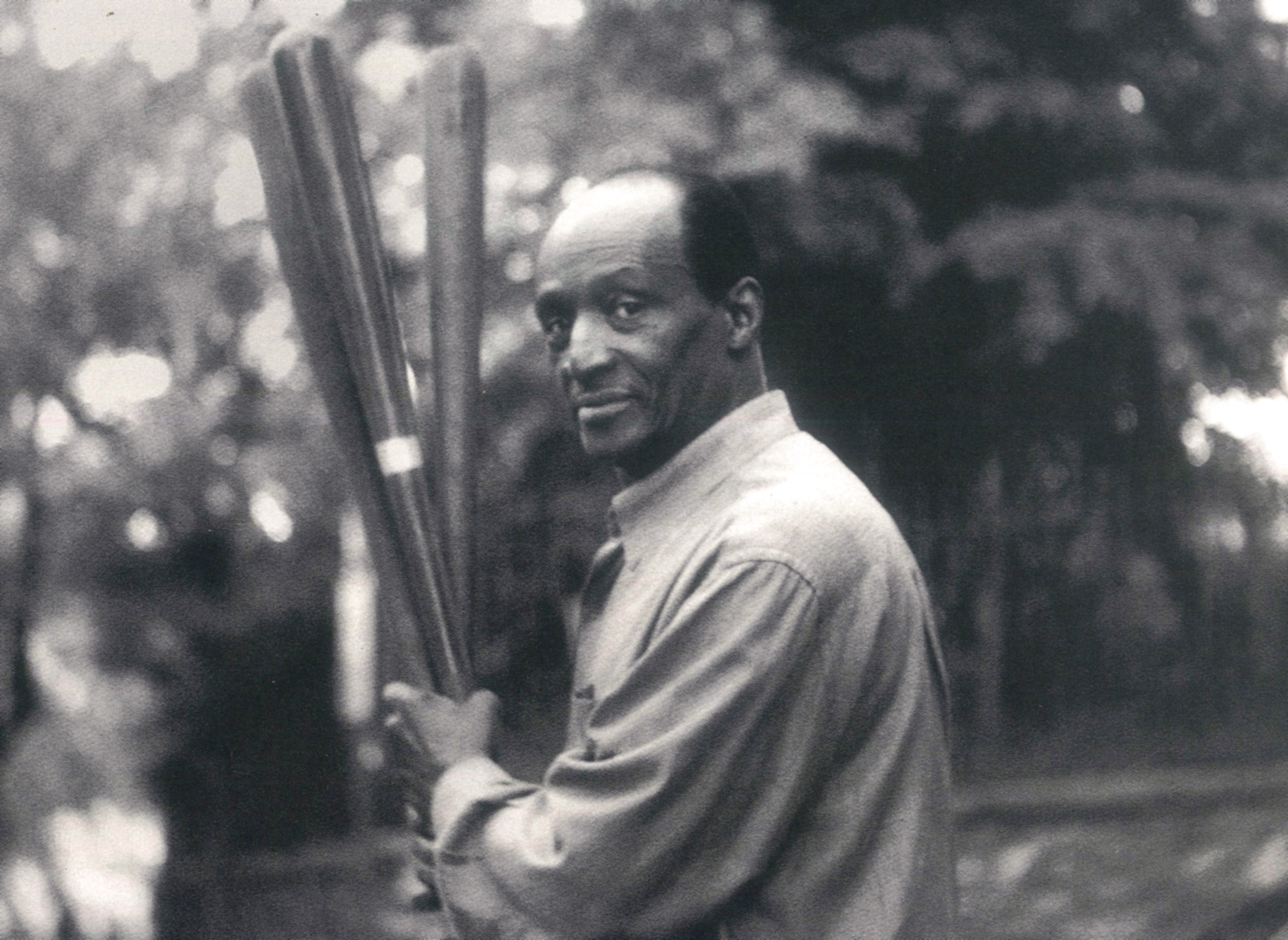 George Preston holding baseball bats, photographed by Daniella Zalcman