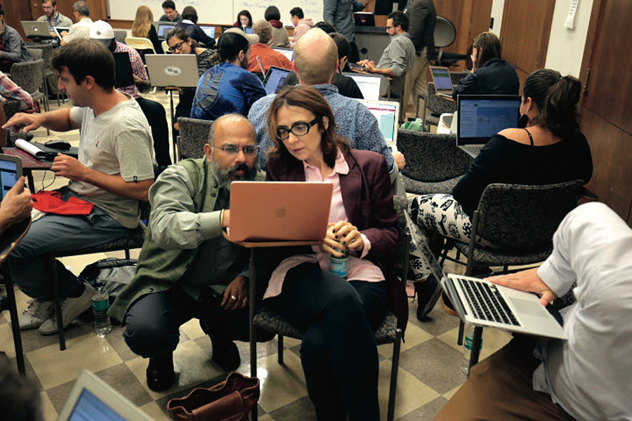 Photo of people on laptop