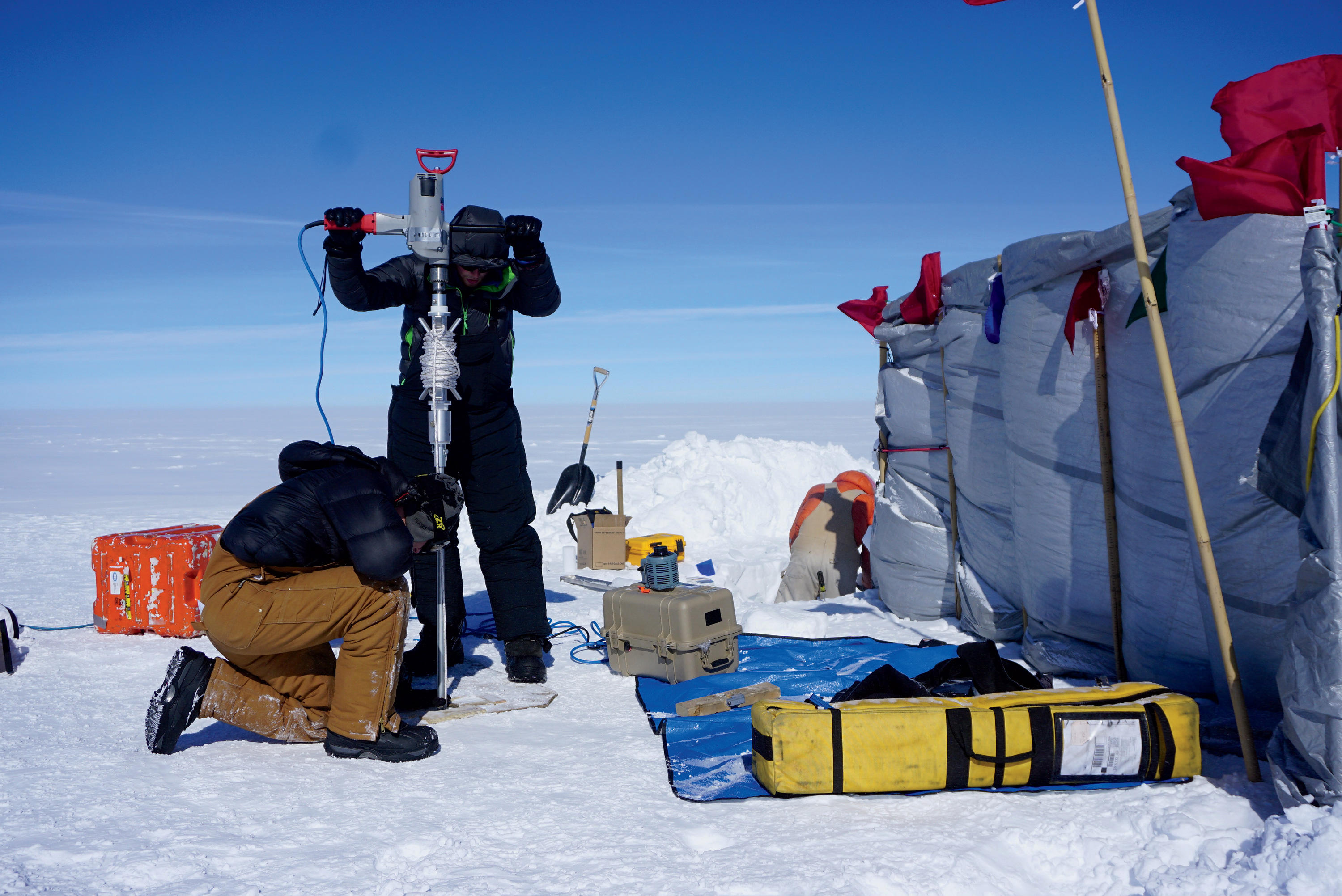 Scientists drilling ice