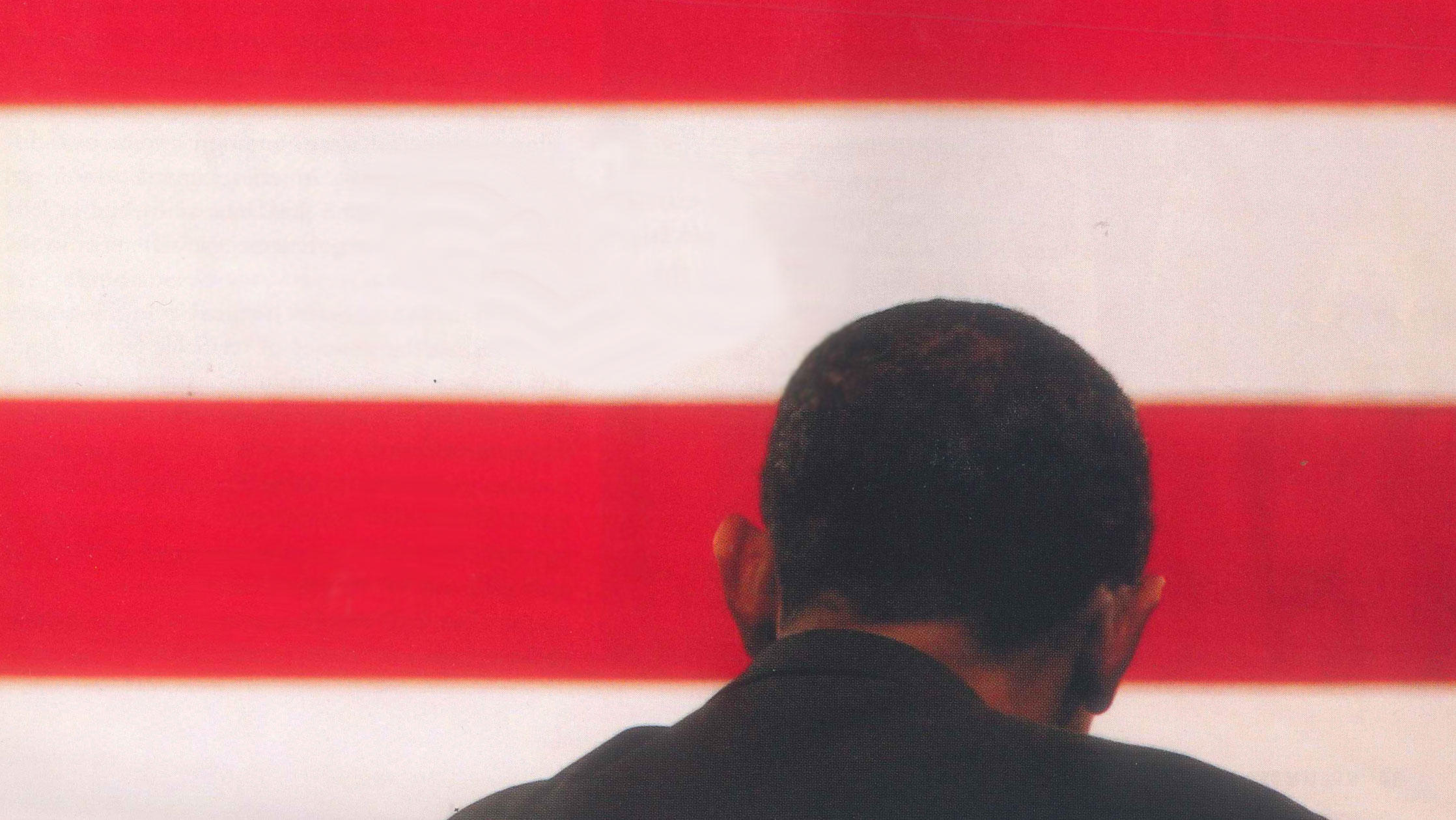 Photograph of the back of Barack Obama's head over American flag stripes