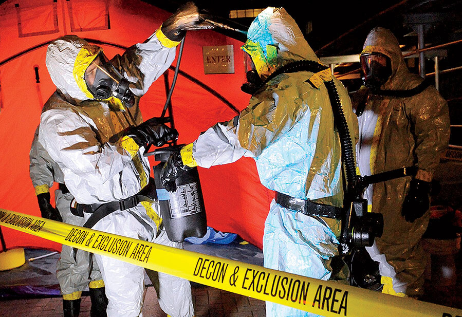 First responders test a novel disinfectant that Columbia students created to clean hazmat suits.