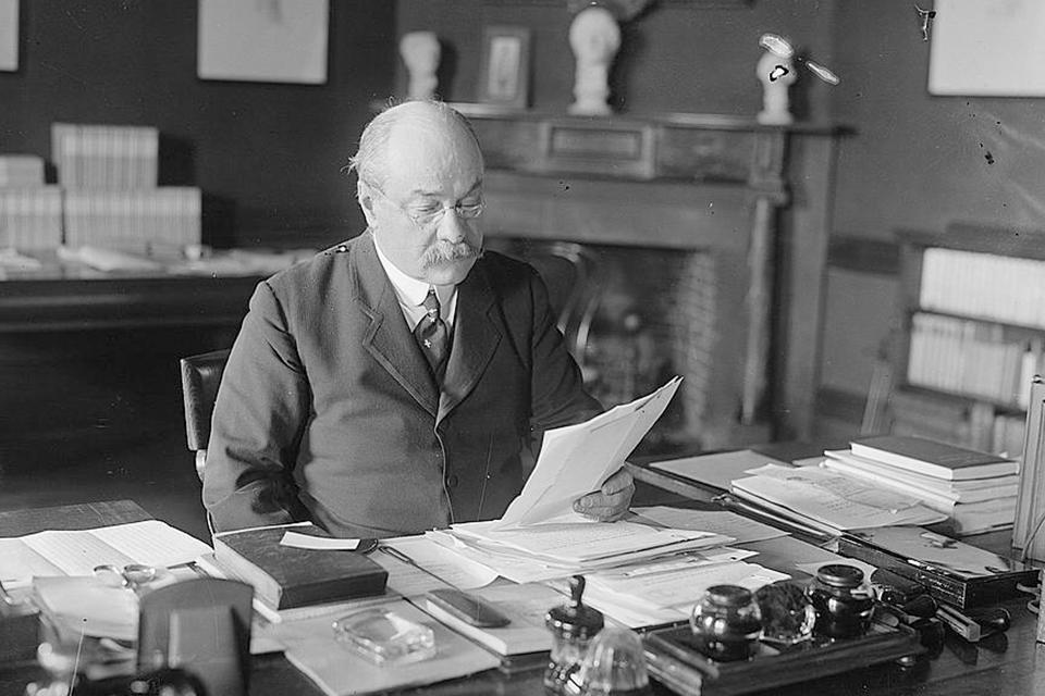 Nicholas Murray Butler photographed at desk in 1916 (Library of Congress)