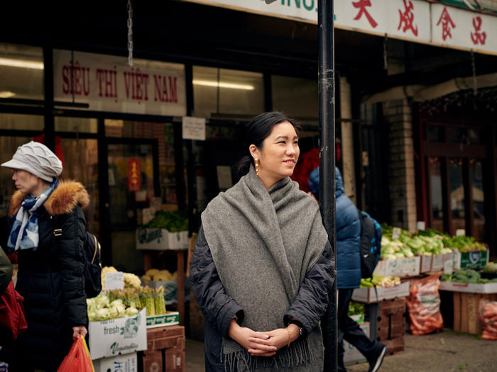 MOLD magazine founder LinYee Yuan in front of a food market