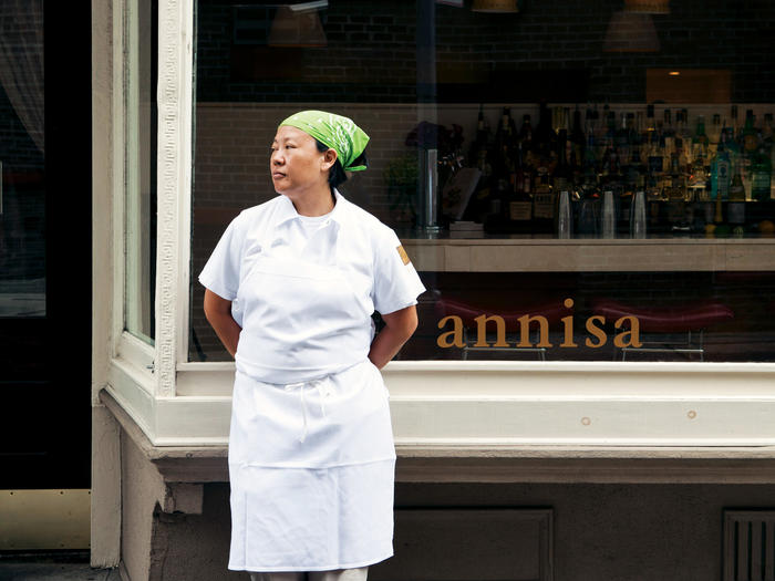 Anita Lo in front of Annisa restaurant