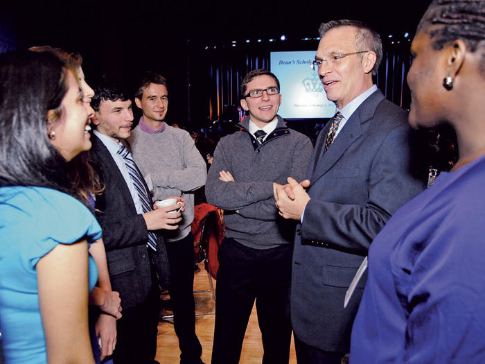 James J. Valentini chatting with students at the Dean's Scholarship Reception in February 2012
