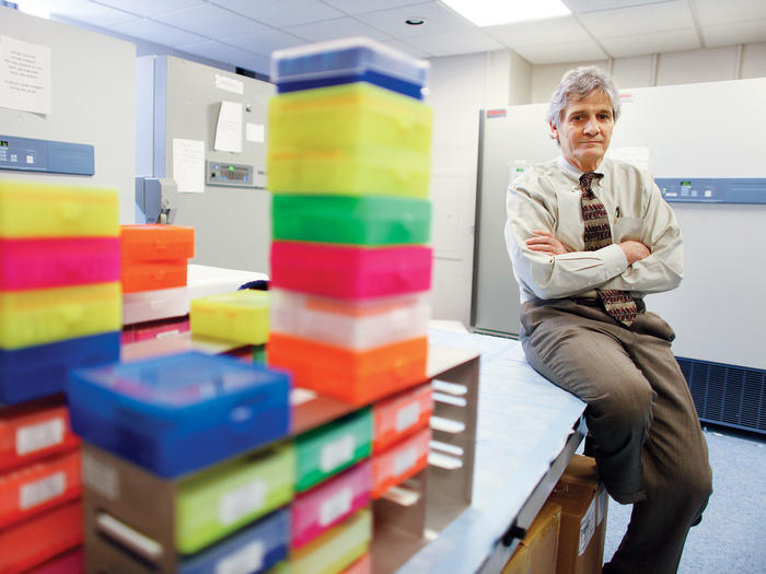 Richard Mayeux with DNA test kits used to study Alzheimer's disease. (Chang W. Lee / The New York Times / Redux)