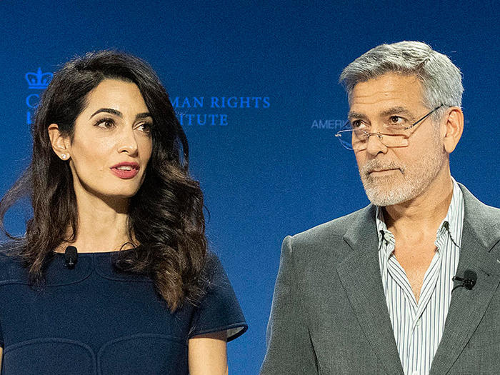 Amal and George Clooney speaking at Columbia Law School