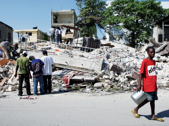 People sifting through rubble in downtown Port-au-Prince after the 2010 Haitian earthquake