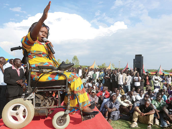 Dennitah Ghati, a disability advocate in Kenya, speaking at an event in Kenya