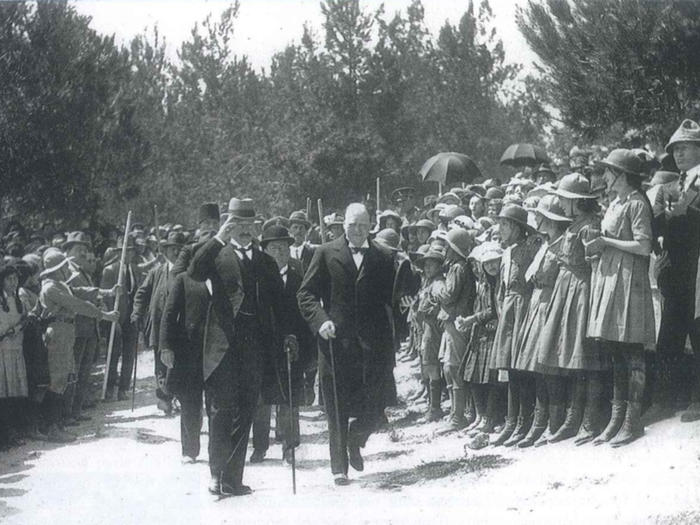 Winston Churchill and Herbert Samuel, high commissioner of Palestine, walking toward the site of Hebrew University in Jerusalem, March 1921