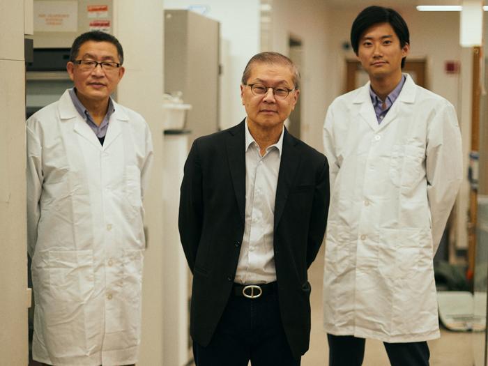 David D. Ho, center, with fellow ADARC scientists Yaoxing Huang and Sho Iketani (Samantha Casolari / Bloomberg Businessweek).