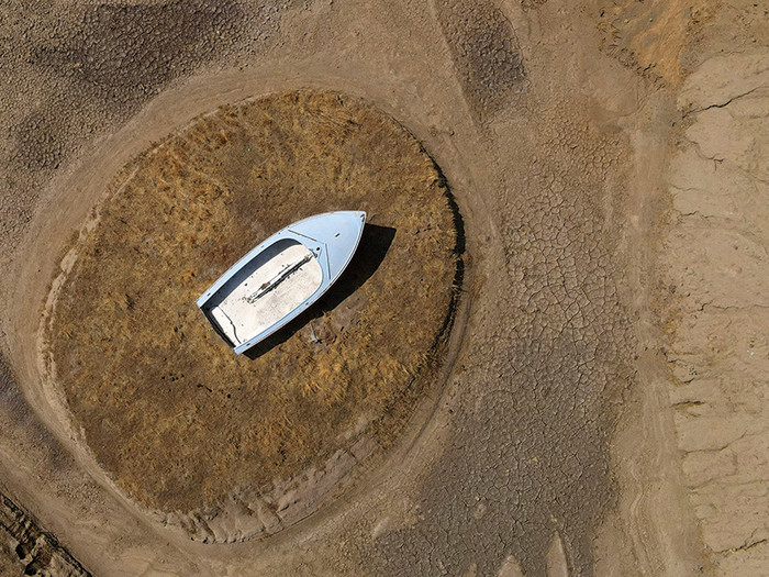 A boat on a dried up lake