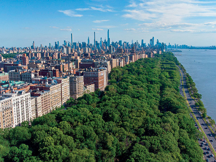 Overhead view shot of Riverside Park, West Side Highway, and Hudson River beside Columbia University campus