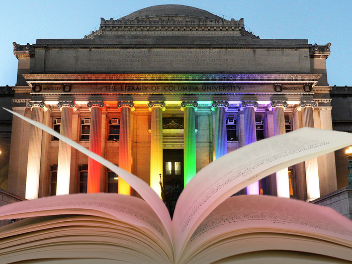 Open book with Low Library lit in rainbow colors