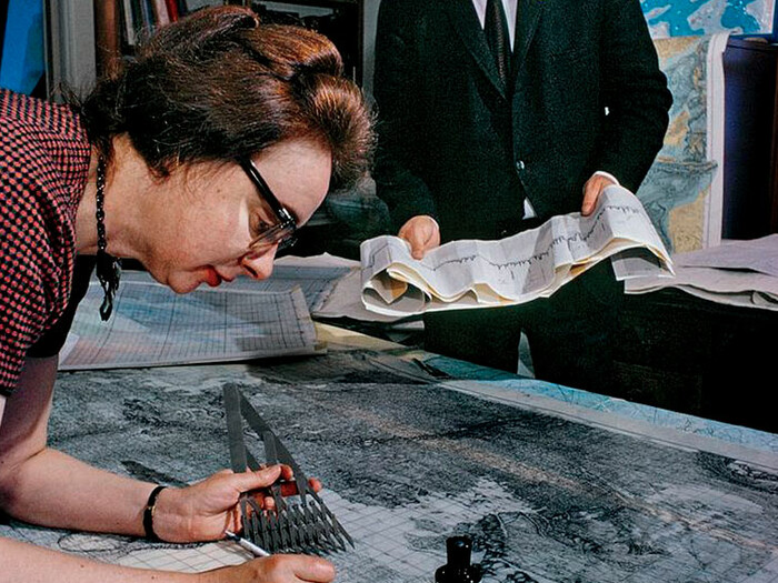Scientists Marie Tharp and Bruce Heezen working on maps
