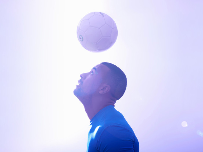 soccer player hitting ball with head