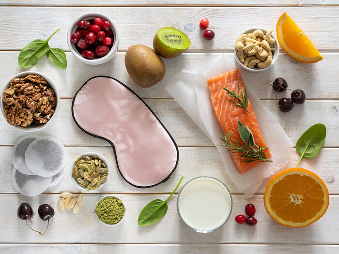 photo of table with nutritious food and sleep mask