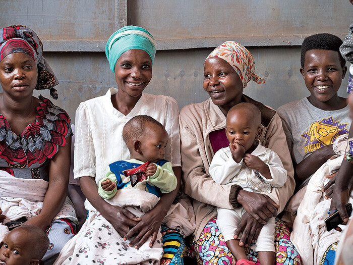 Women holding babies in Africa