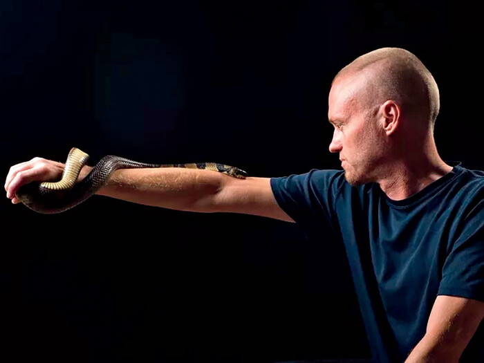 Tim Friede holding a snake