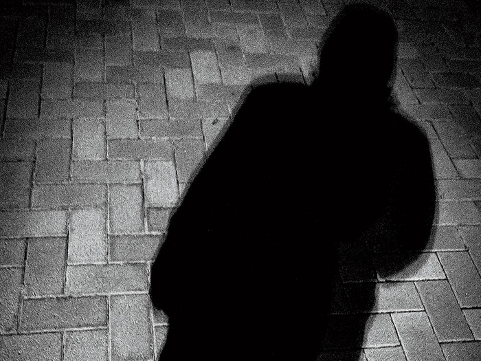 A shadow of a man against the ground