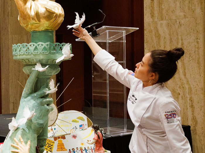 Grace Pak decorates the official America250 cake