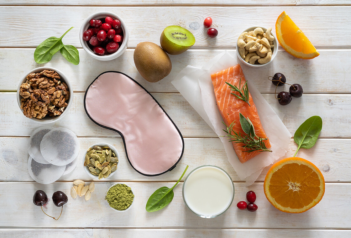 photo of table with nutritious food and sleep mask