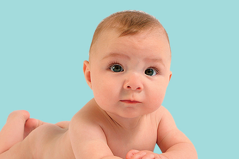 A baby over teal background