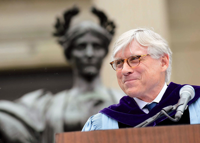 Columbia University president Lee C. Bollinger in front of Alma Mater statue on Low Library steps