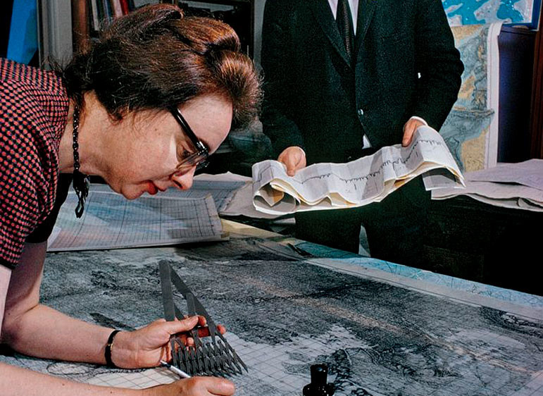 Scientists Marie Tharp and Bruce Heezen working on maps