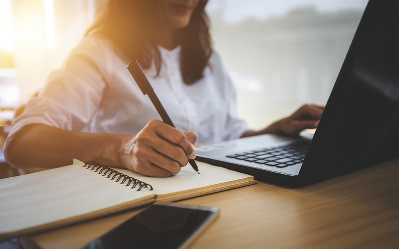 A woman taking an online course