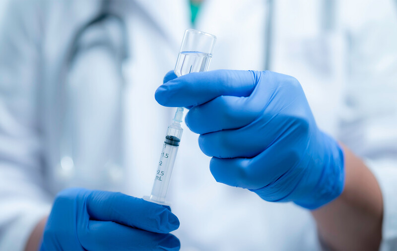 Doctor preparing vaccine