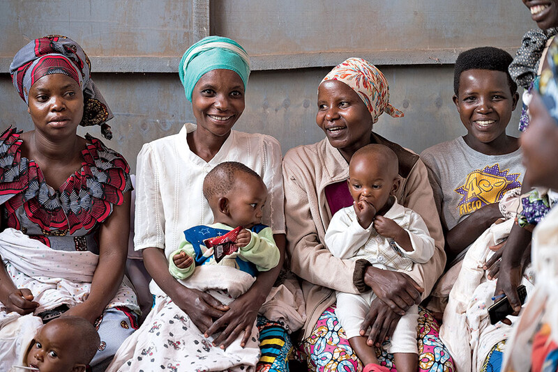 Women holding babies in Africa