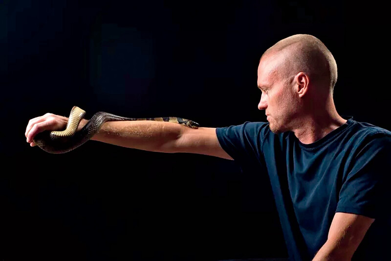 Tim Friede holding a snake