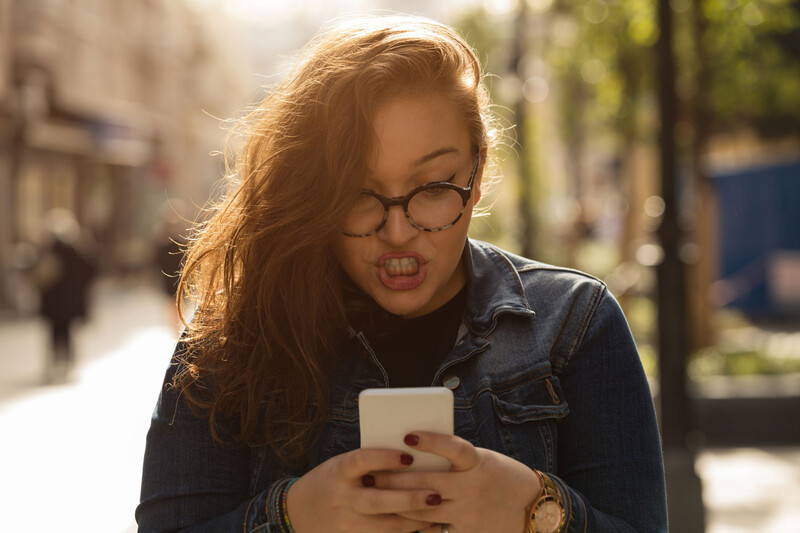 Photo of a woman looking at her phone