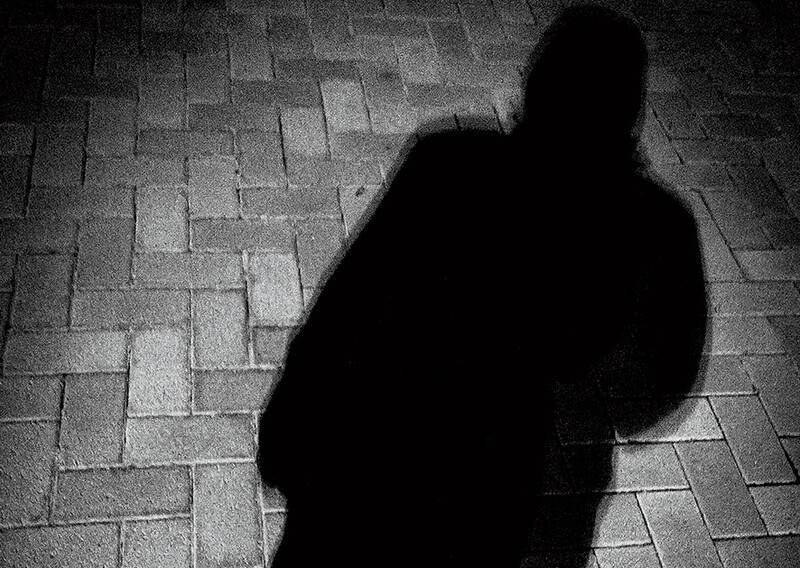 A shadow of a man against the ground