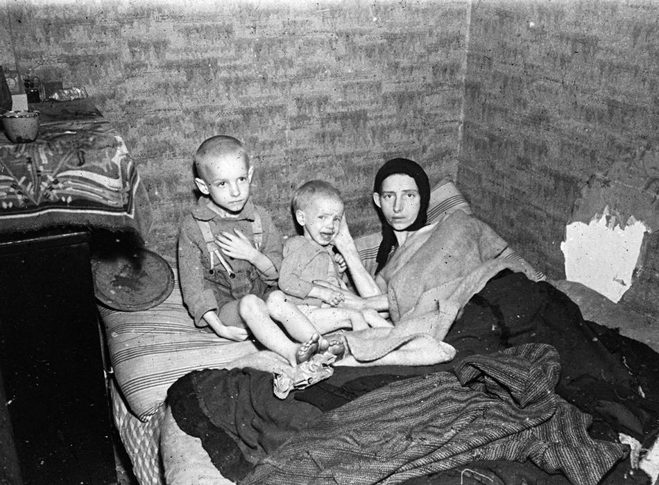 A mother and two children during the Dutch famine of 1944