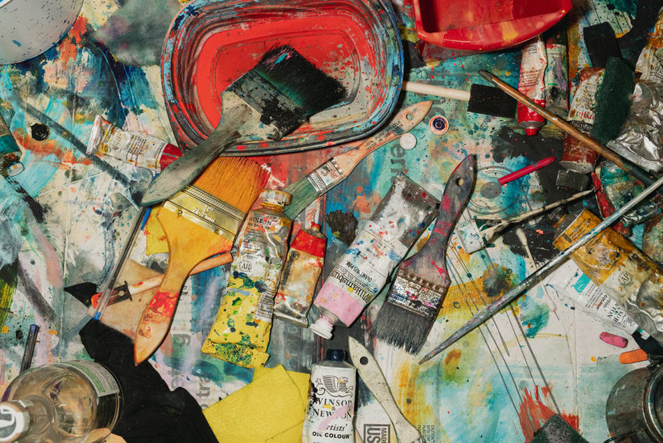 Paint and brushes in Cy Gavin's studio