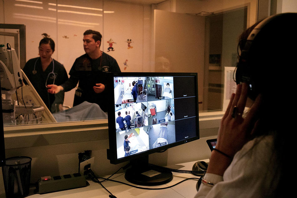 At Columbia Nursing School's patient simulation center, Nursing professor Kellie Bryant observes the students from behind a one-way mirror.