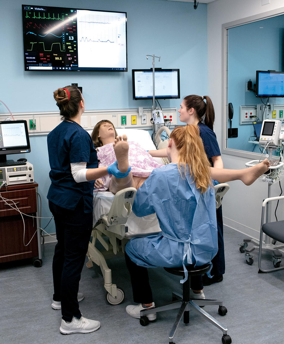 At Columbia Nursing School's patient simulation center, students oversee the birth of a four-pound plastic robot baby.