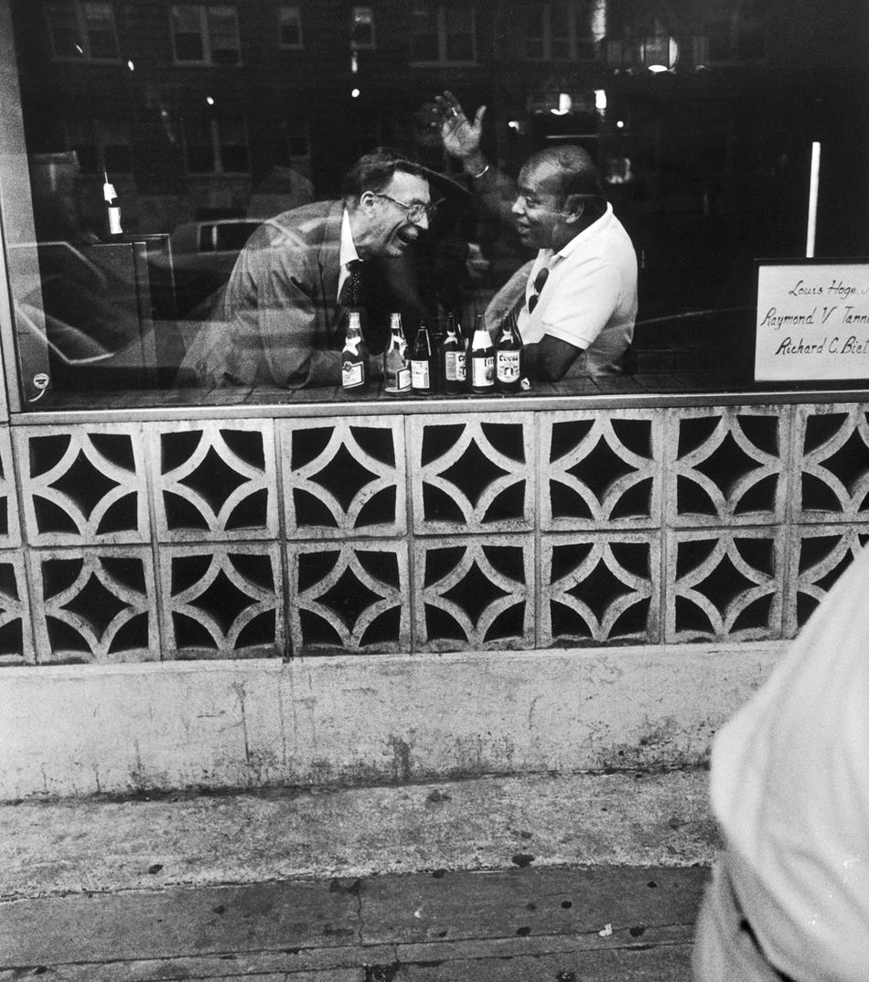 Photograph of two men in a bar by Jack Eisenberg