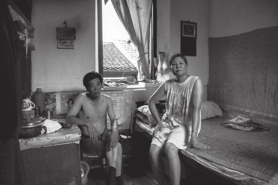 Photo of couple in apartment Shanghai, by Howard French
