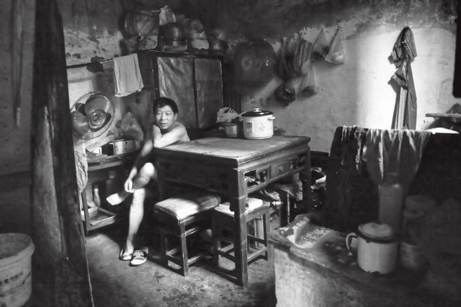 Photo of man in apartment in Shanghai, by Howard French