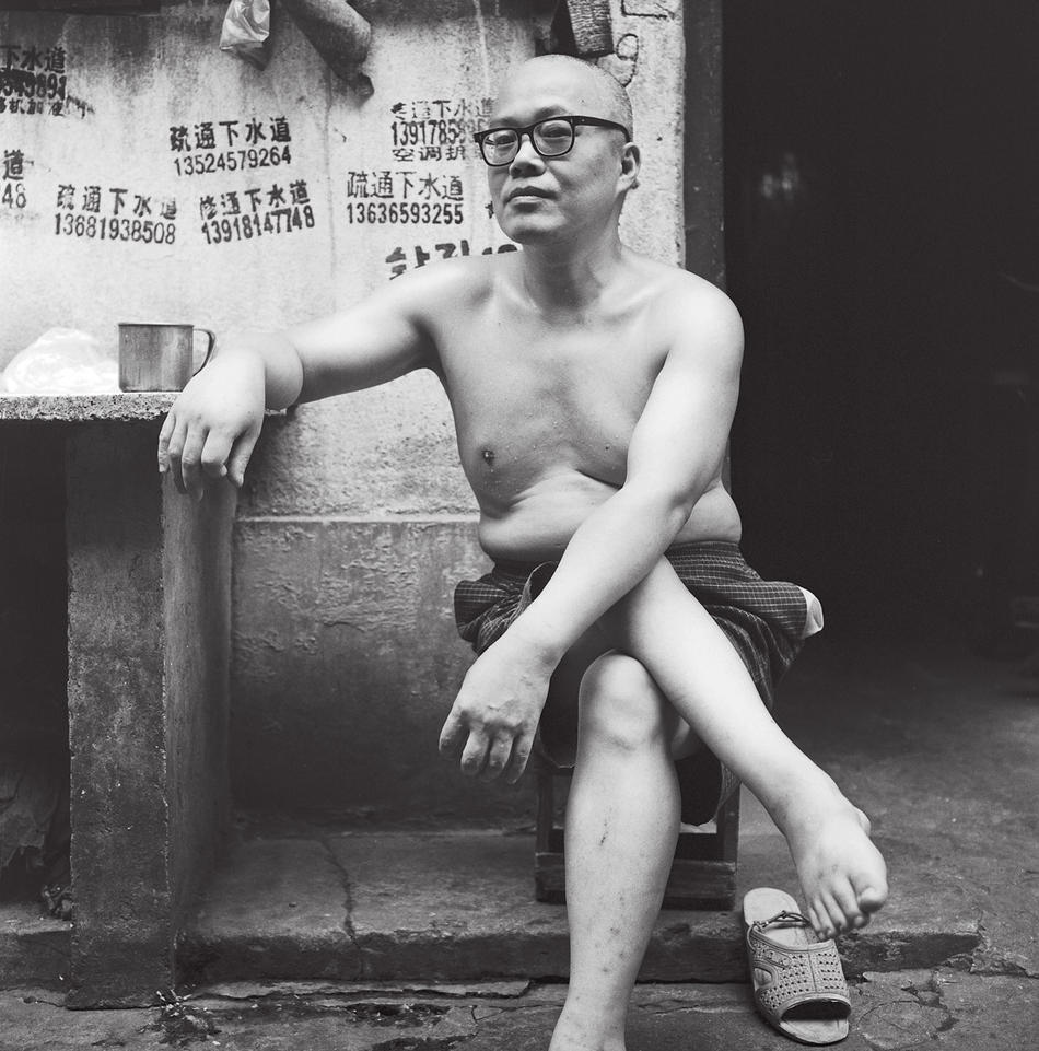 Photo of shirtless man in Shanghai, by Howard French