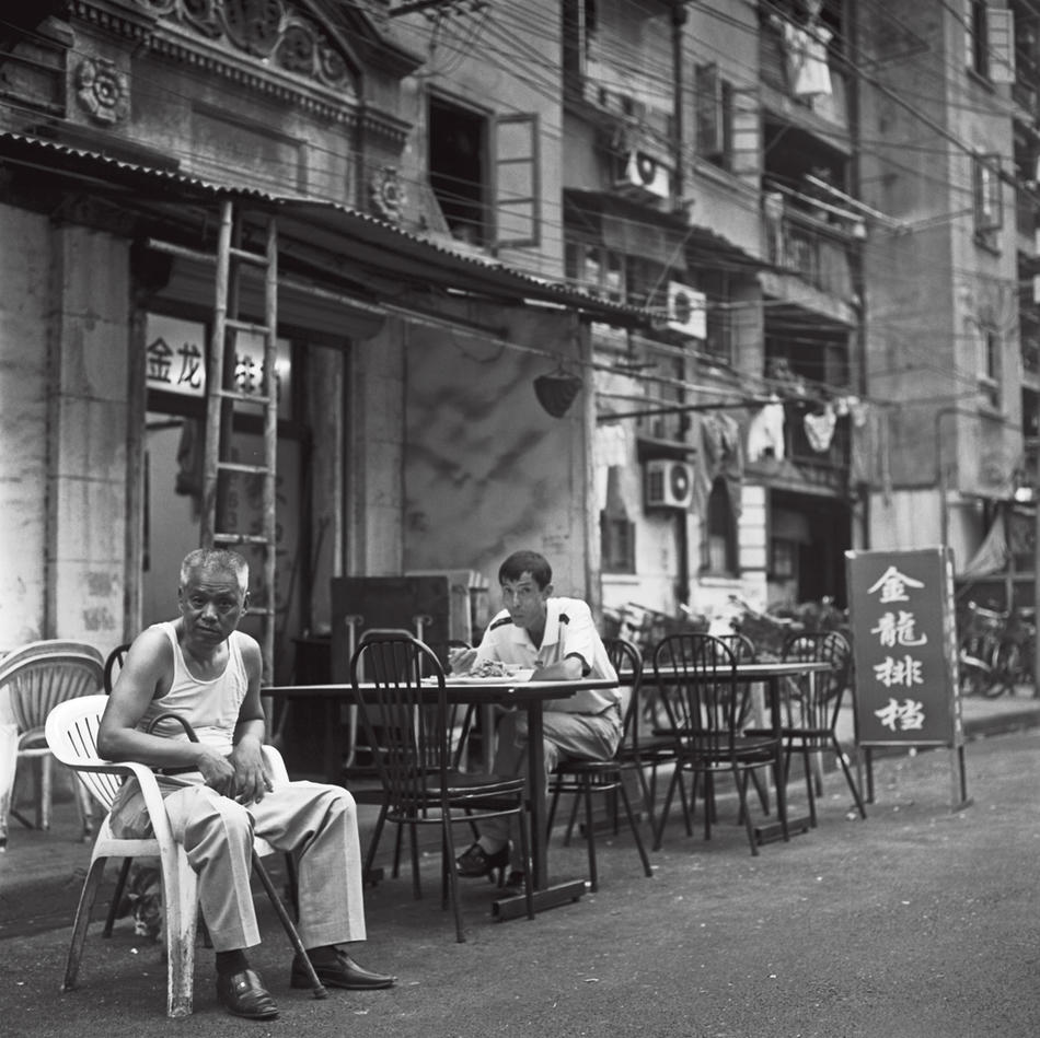 Photo of men on Shanghai street, by Howard French