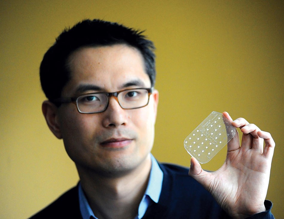 Samuel Sia holding diagnostic device